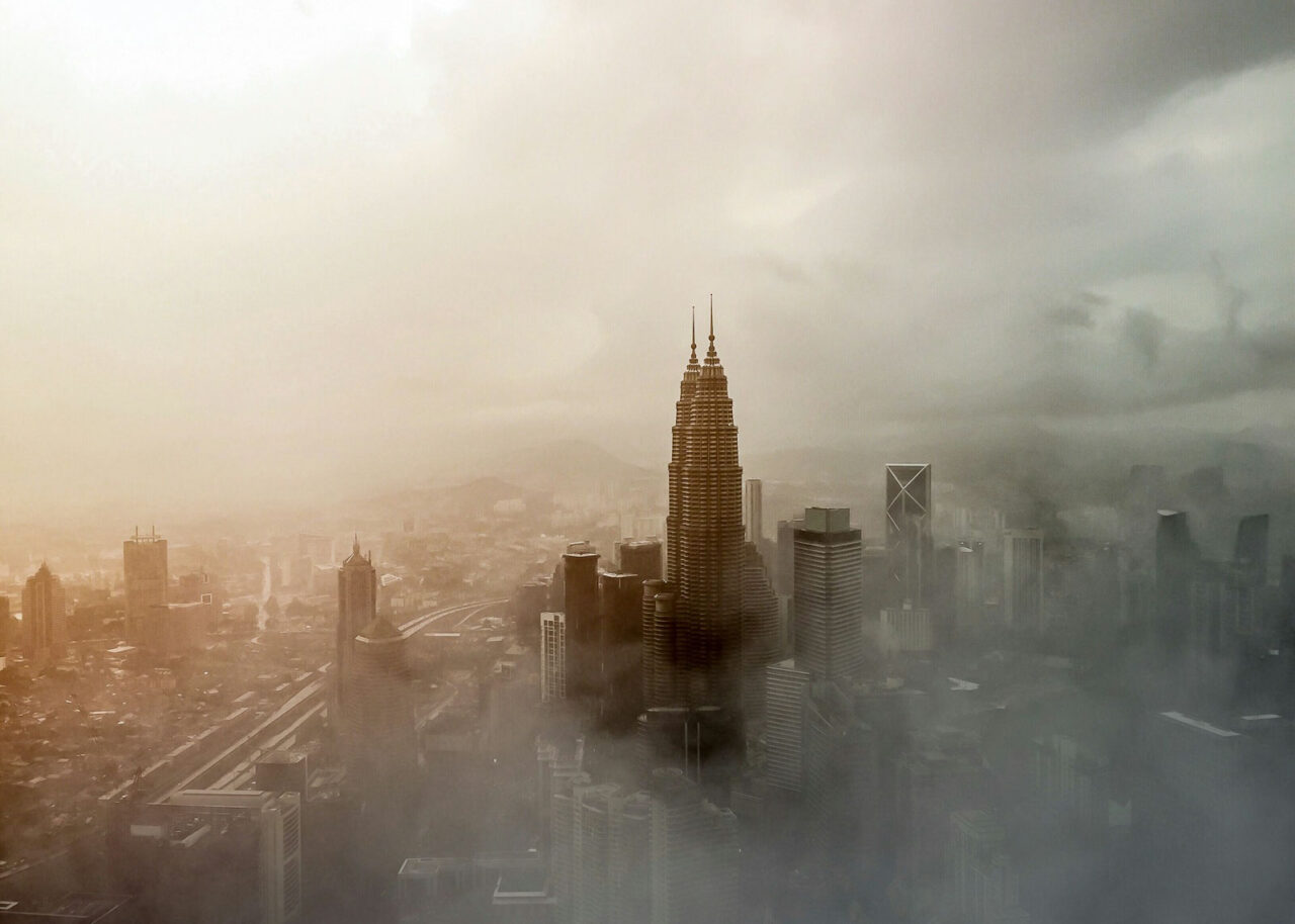kuala-lumpur-smog-1280x914-1 Petronas Towers in Kuala Lumpur surrounded by smog