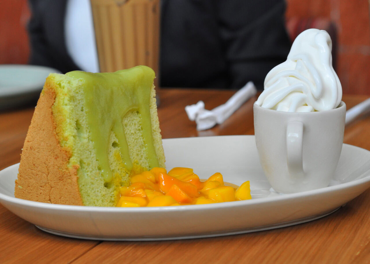 Pandan cake with whipped cream and mango